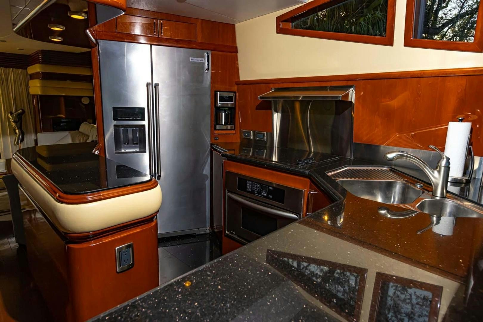 a kitchen with stainless steel appliances aboard DECKED OUT Yacht for Sale