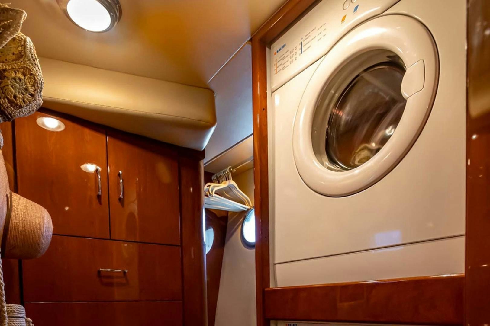 a washing machine in a room aboard DECKED OUT Yacht for Sale
