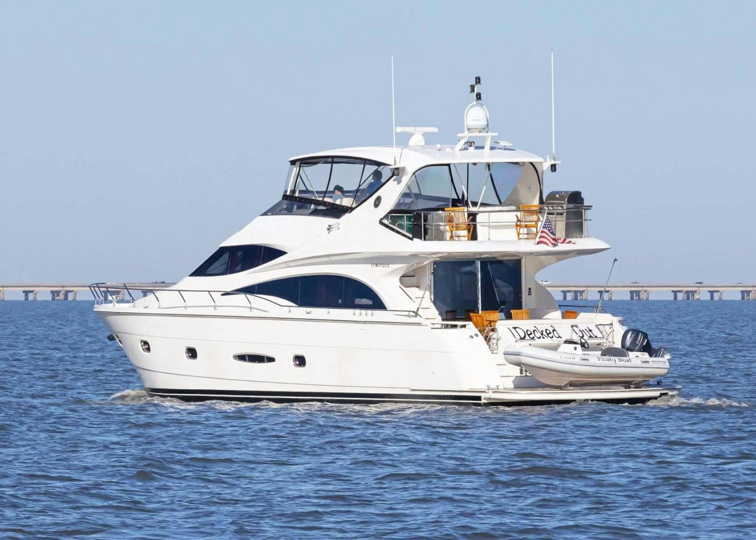 a white boat in the water aboard DECKED OUT Yacht for Sale