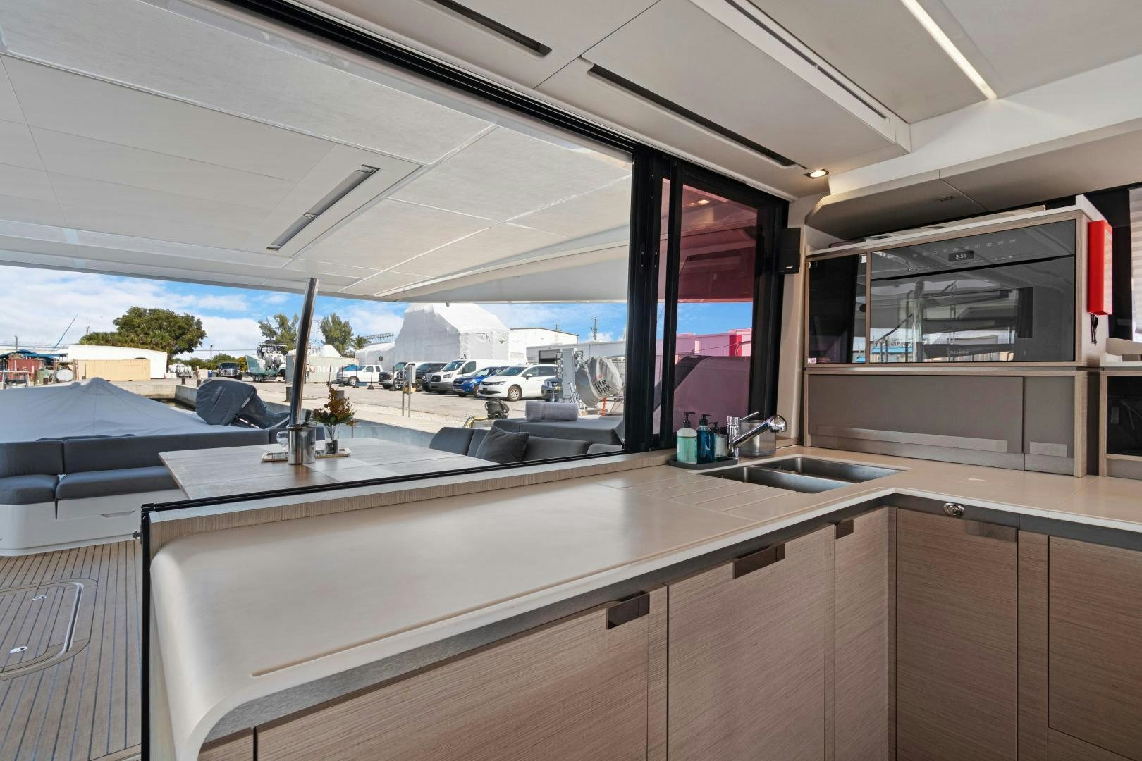 a kitchen with a large window aboard Ocean Seven Yacht for Sale