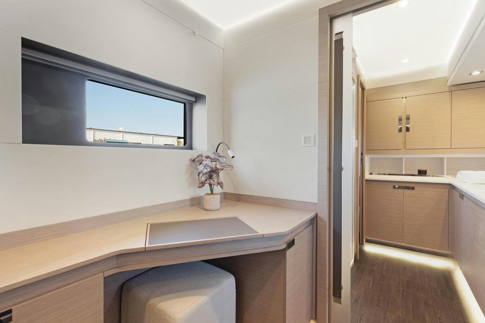 a bathroom with a sink and cabinets aboard Ocean Seven Yacht for Sale