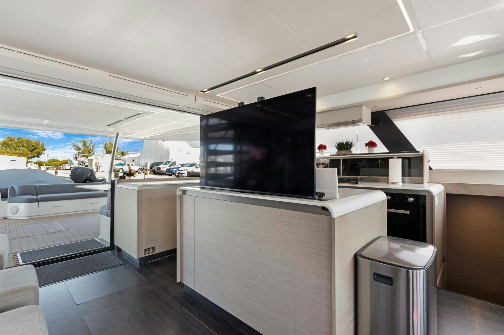 a room with a tv and a couch aboard Ocean Seven Yacht for Sale