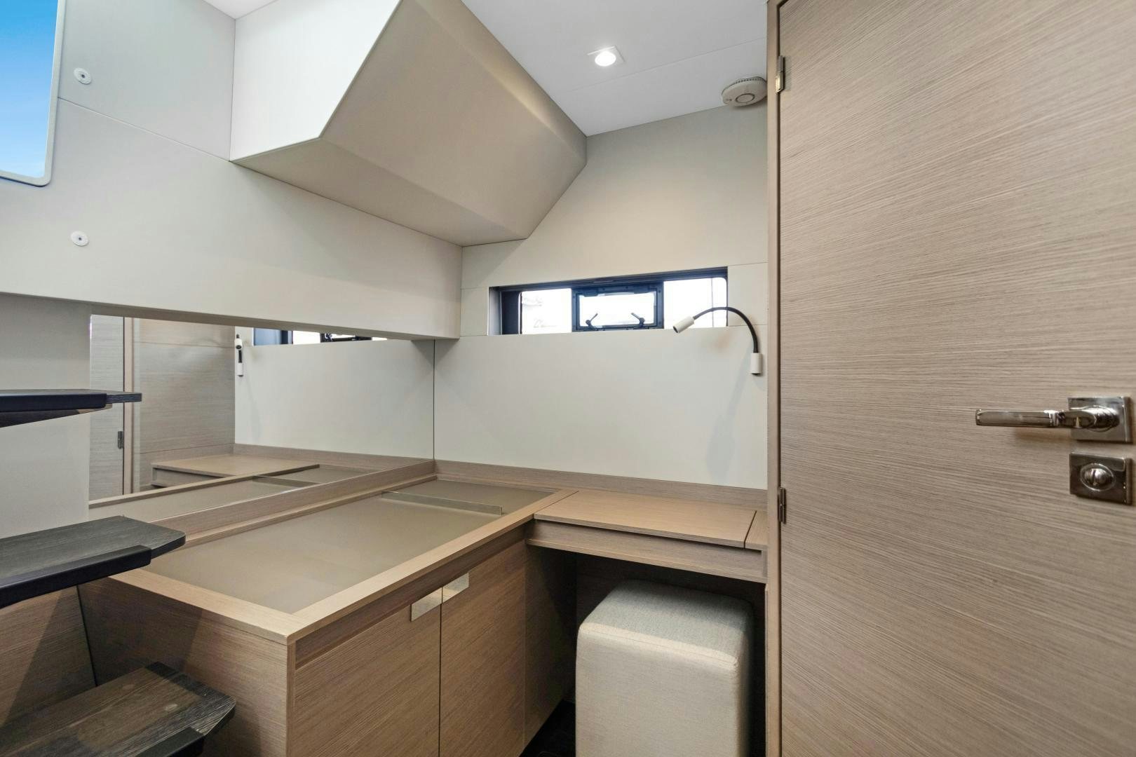 a bathroom with a sink and a mirror aboard Ocean Seven Yacht for Sale