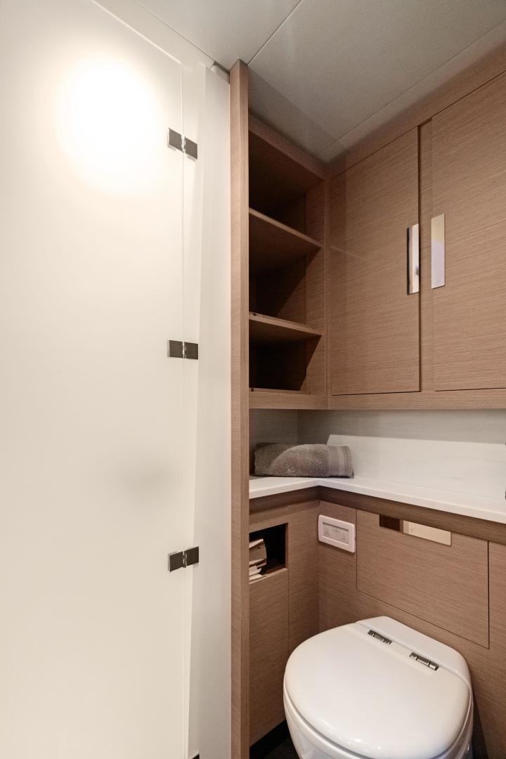 a small bathroom with a toilet aboard Ocean Seven Yacht for Sale