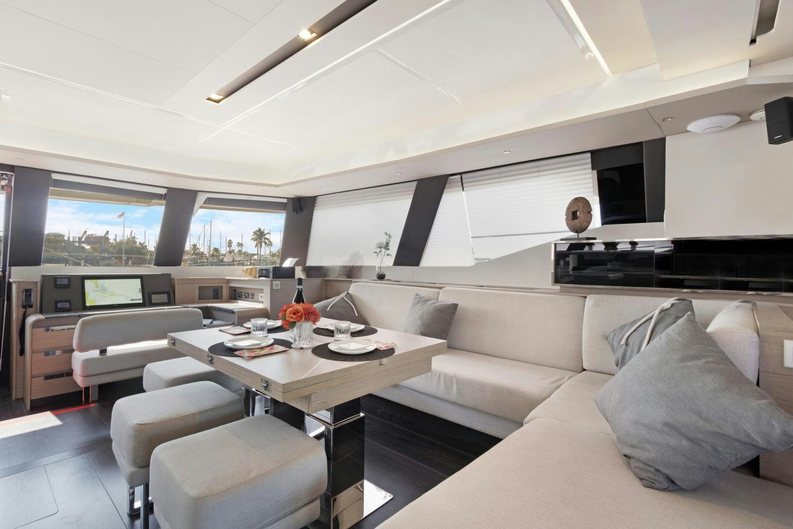 a living room with a couch and a table aboard Ocean Seven Yacht for Sale