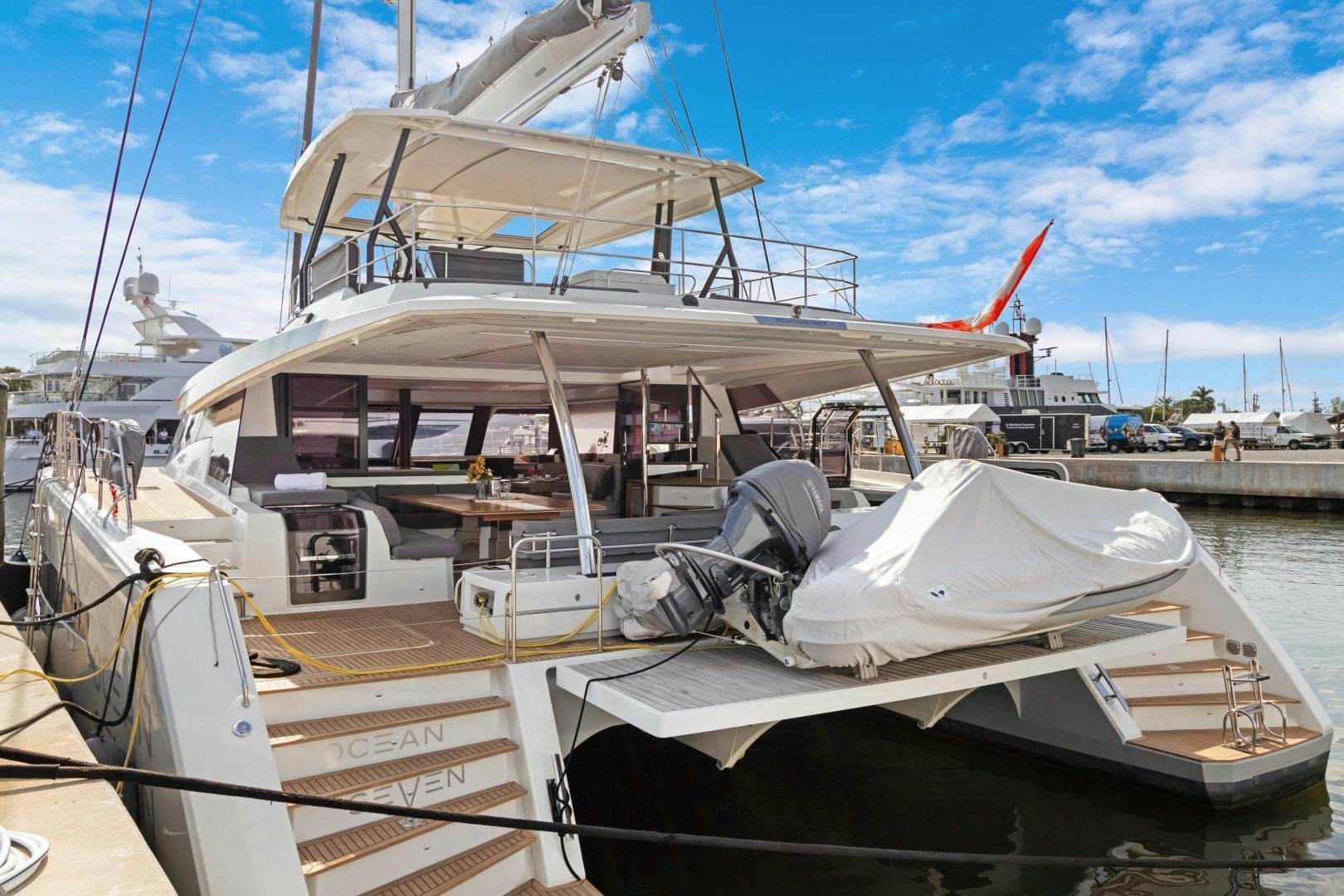 a boat docked at a pier aboard Ocean Seven Yacht for Sale