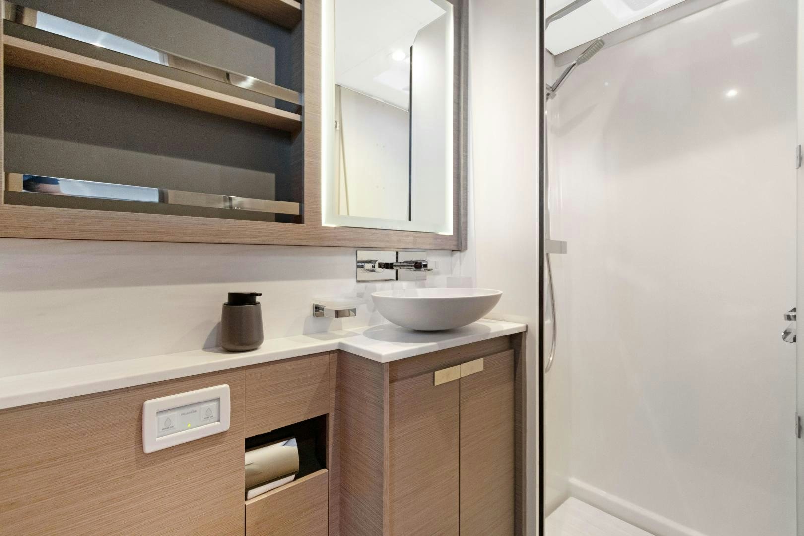 a bathroom with a sink and a mirror aboard Ocean Seven Yacht for Sale