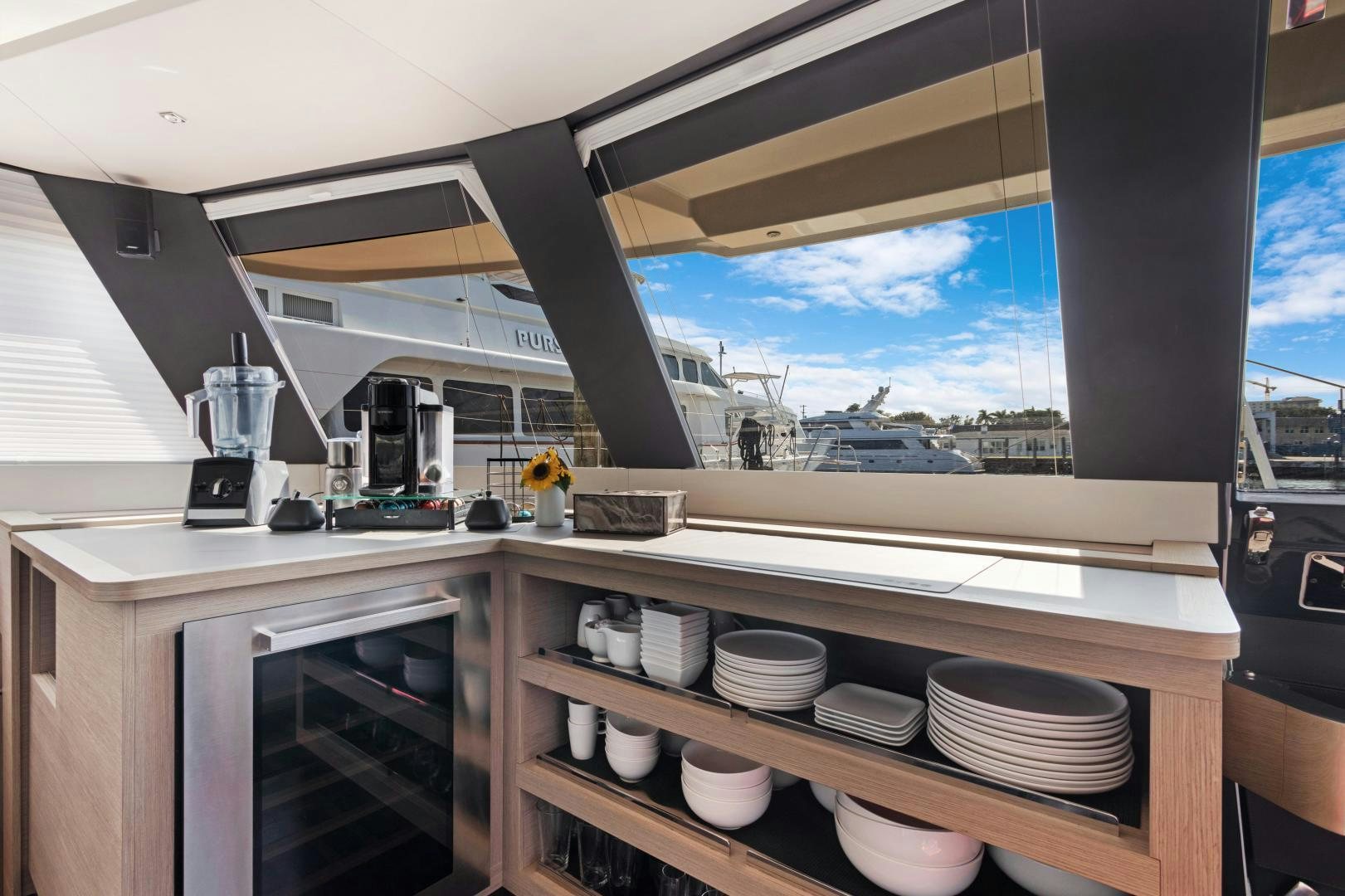a kitchen with a window aboard Ocean Seven Yacht for Sale