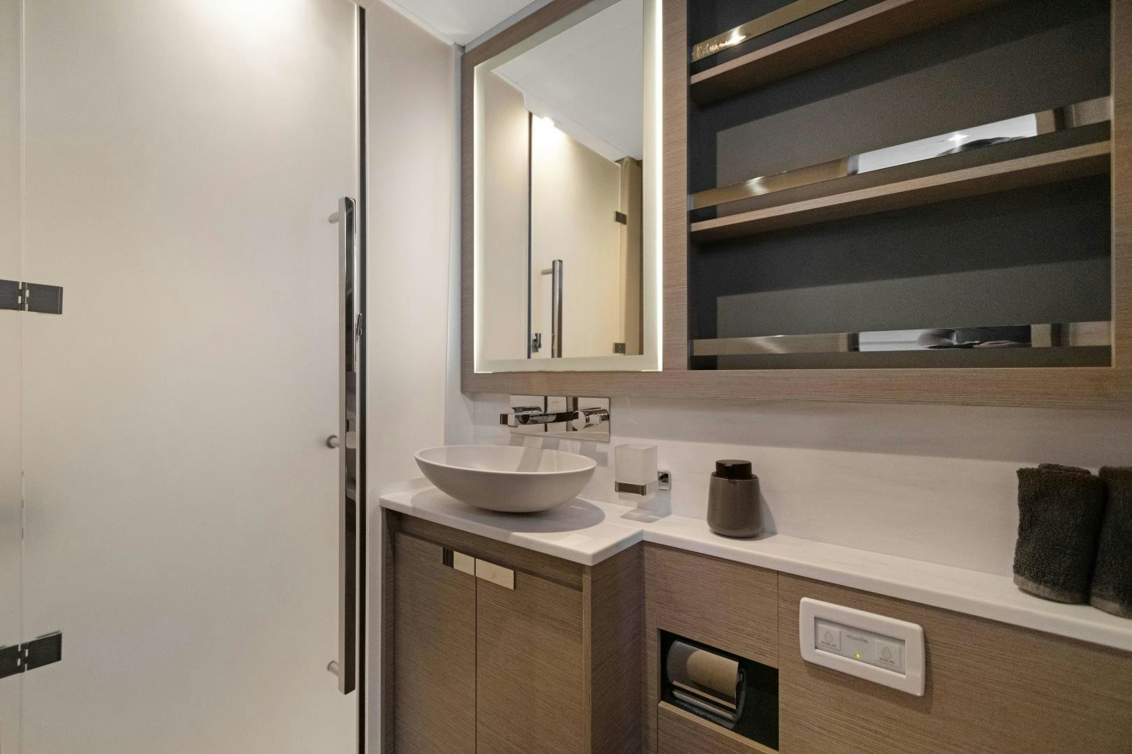 a bathroom with a sink and a mirror aboard Ocean Seven Yacht for Sale