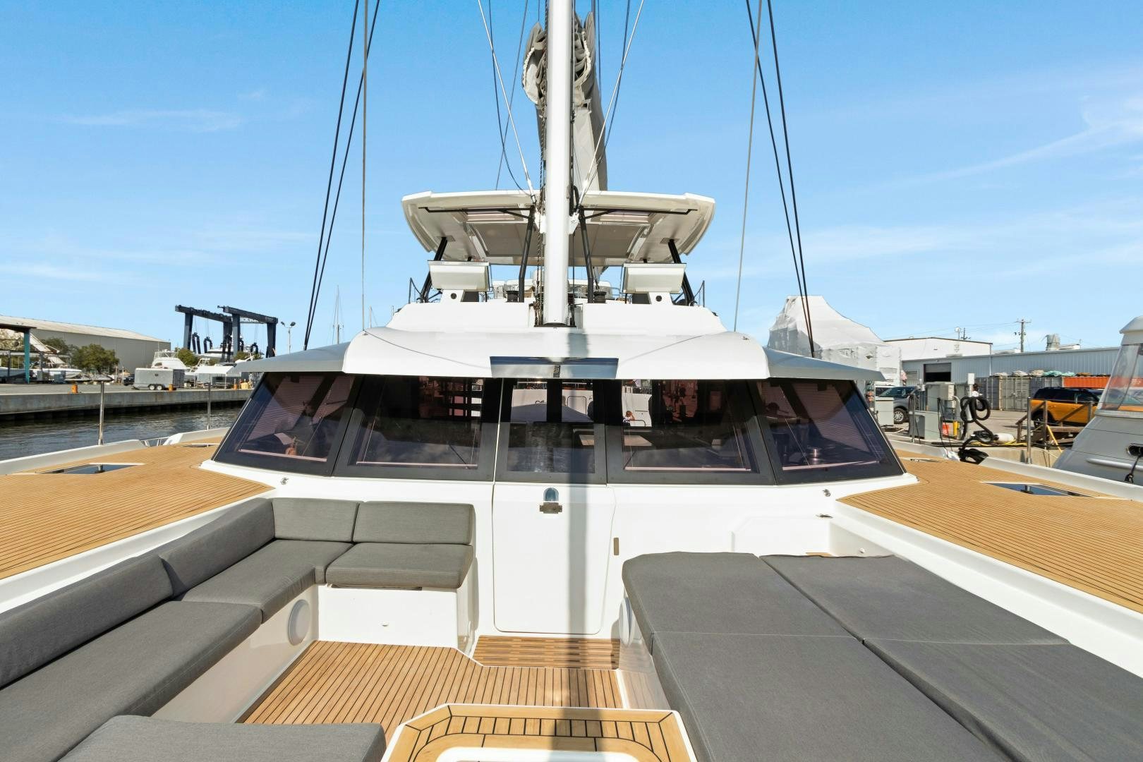 a boat docked at a pier aboard Ocean Seven Yacht for Sale