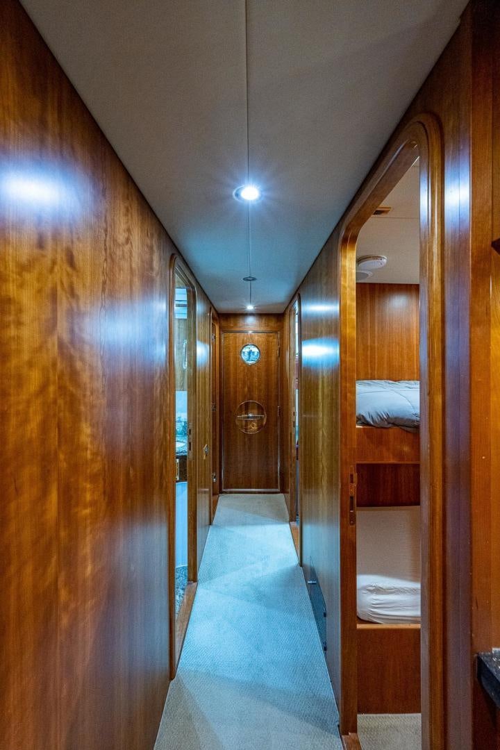 a room with a bed and a mirror aboard ODYSSEY Yacht for Sale