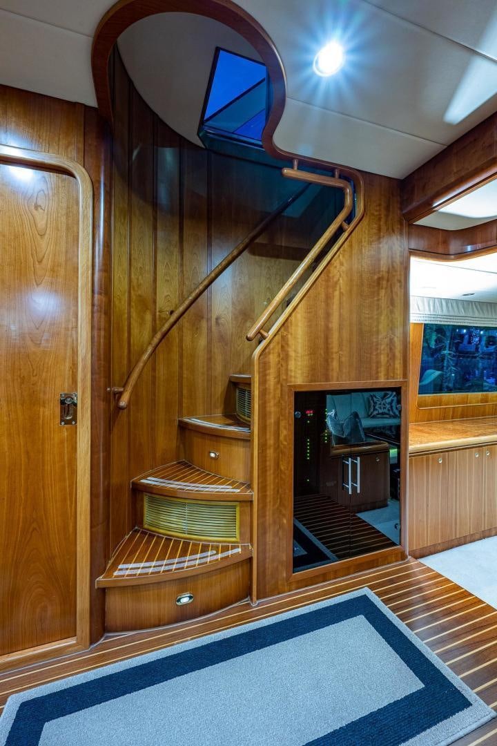 a wood cabinet in a room aboard ODYSSEY Yacht for Sale