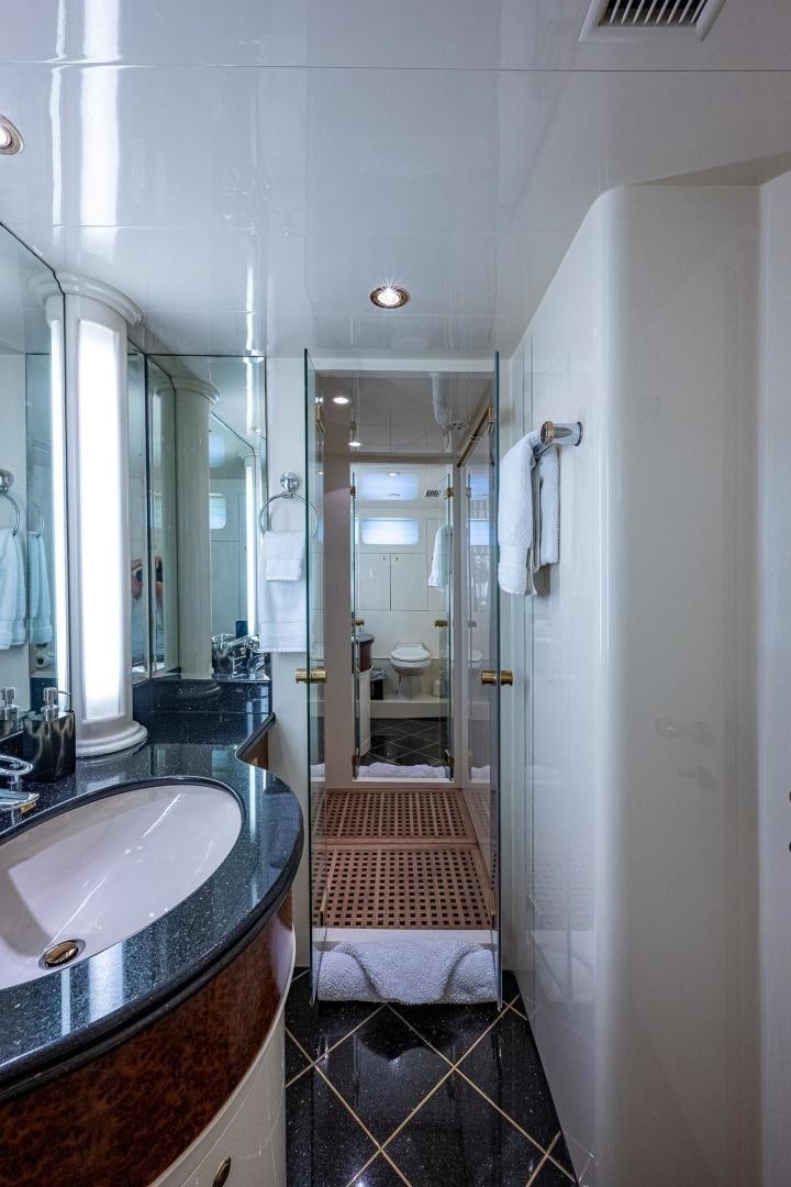 a bathroom with a sink and a mirror aboard ODYSSEY Yacht for Sale