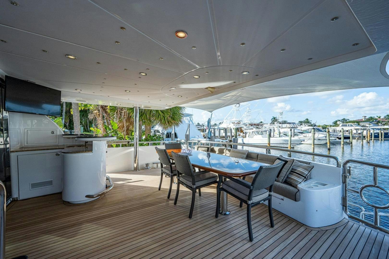 a table and chairs on a deck aboard ODYSSEY Yacht for Sale