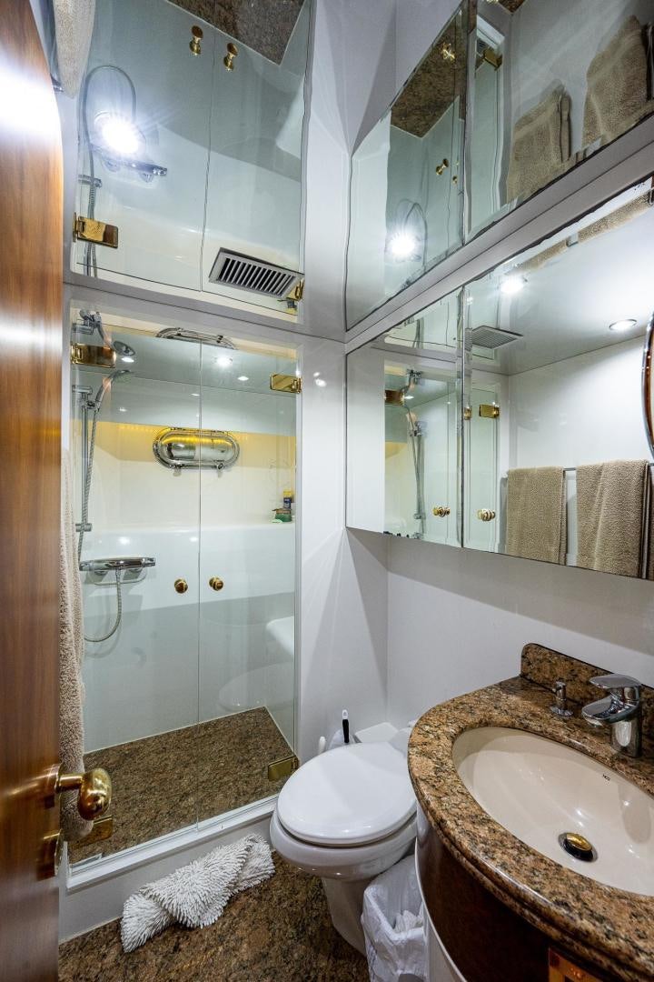a bathroom with a glass shower aboard ODYSSEY Yacht for Sale