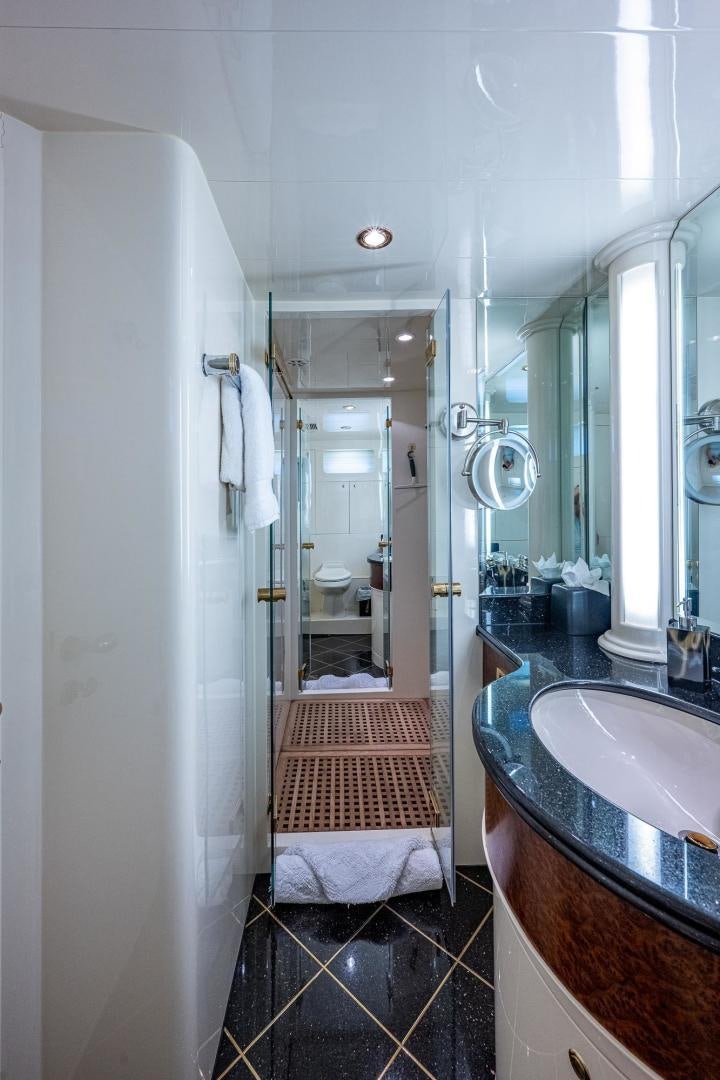 a bathroom with a sink and a mirror aboard ODYSSEY Yacht for Sale