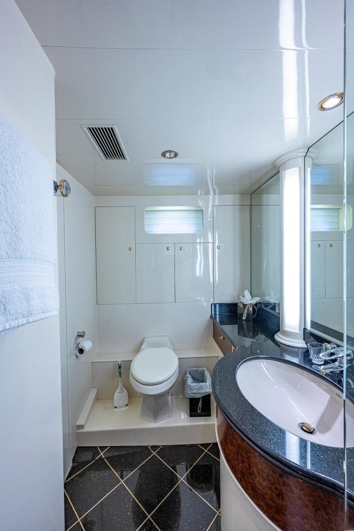 a bathroom with a sink and a toilet aboard ODYSSEY Yacht for Sale