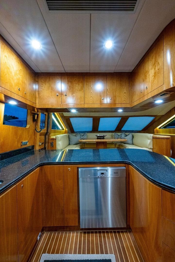 a kitchen with a large island aboard ODYSSEY Yacht for Sale