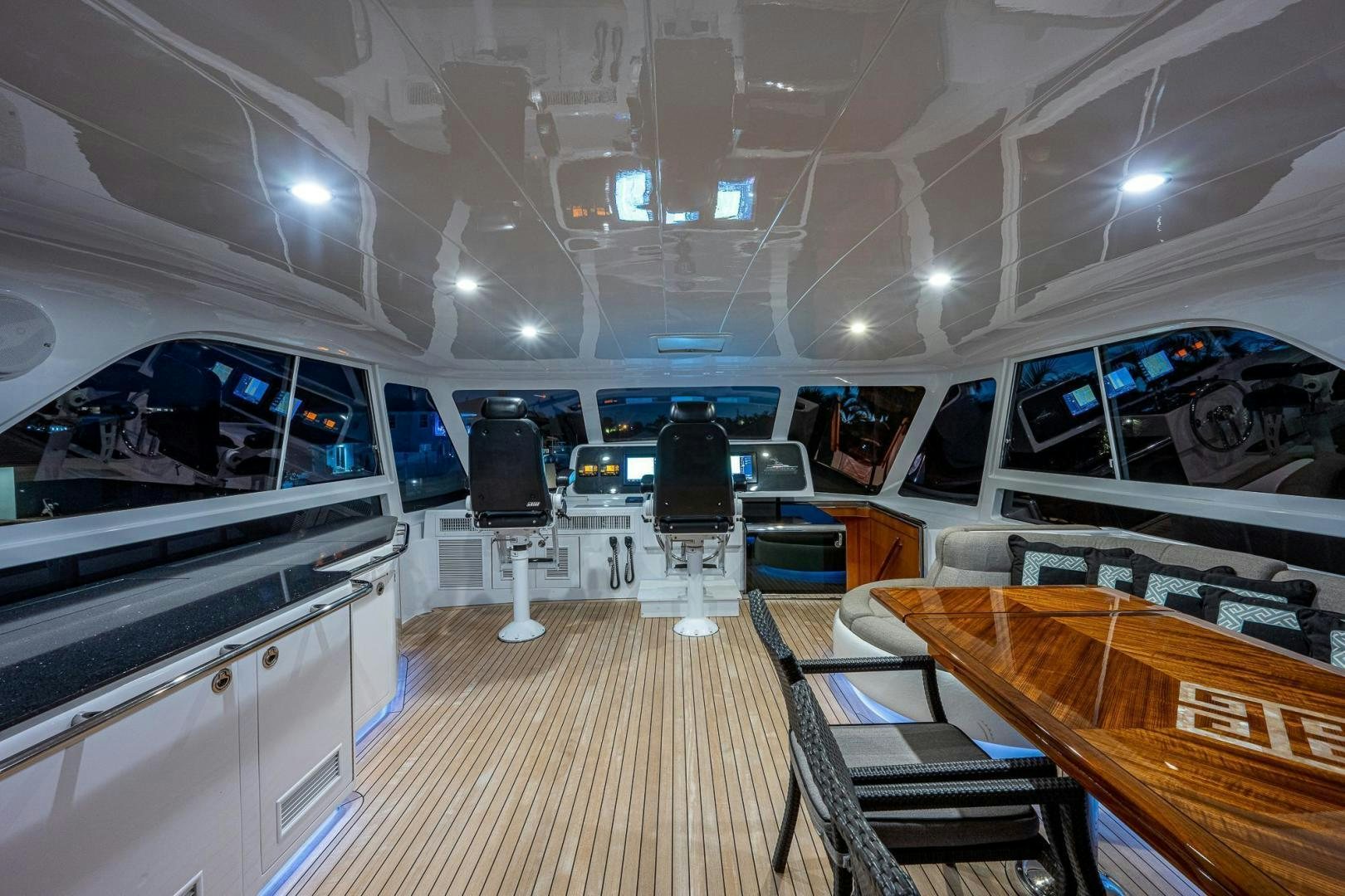 inside of a building with chairs and tables and a large window aboard ODYSSEY Yacht for Sale