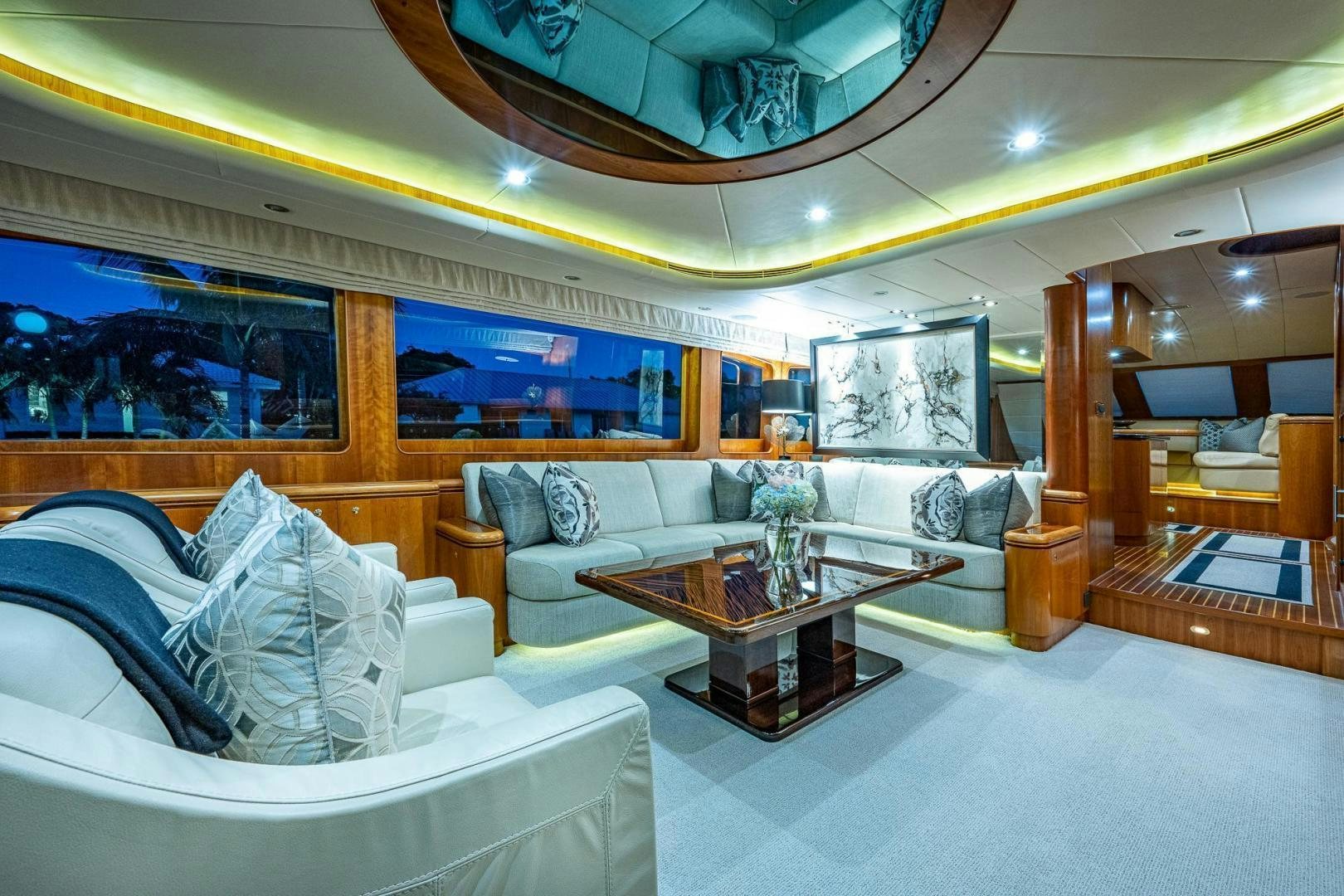 a living room with a large mirror aboard ODYSSEY Yacht for Sale
