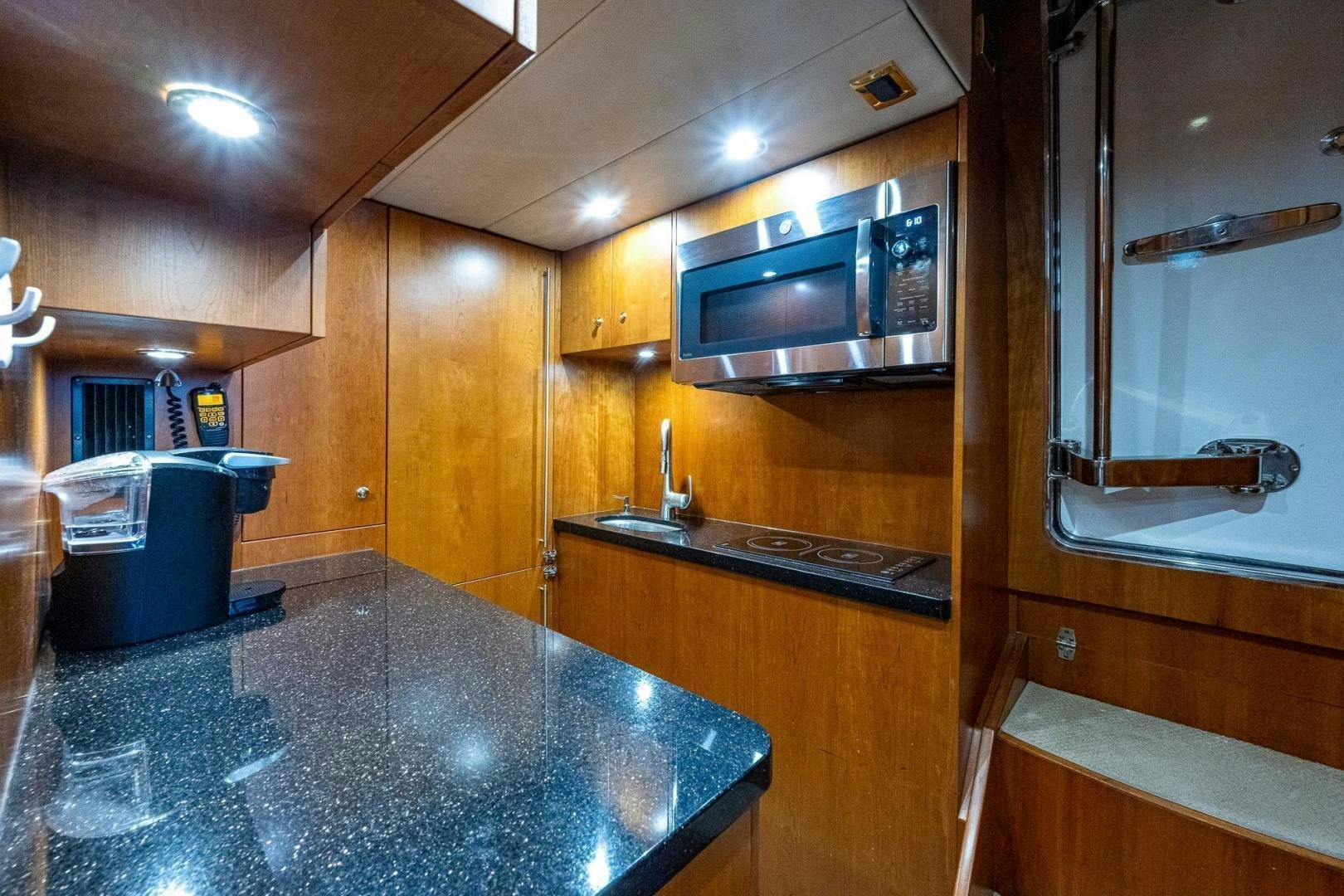 a kitchen with a stainless steel counter aboard ODYSSEY Yacht for Sale