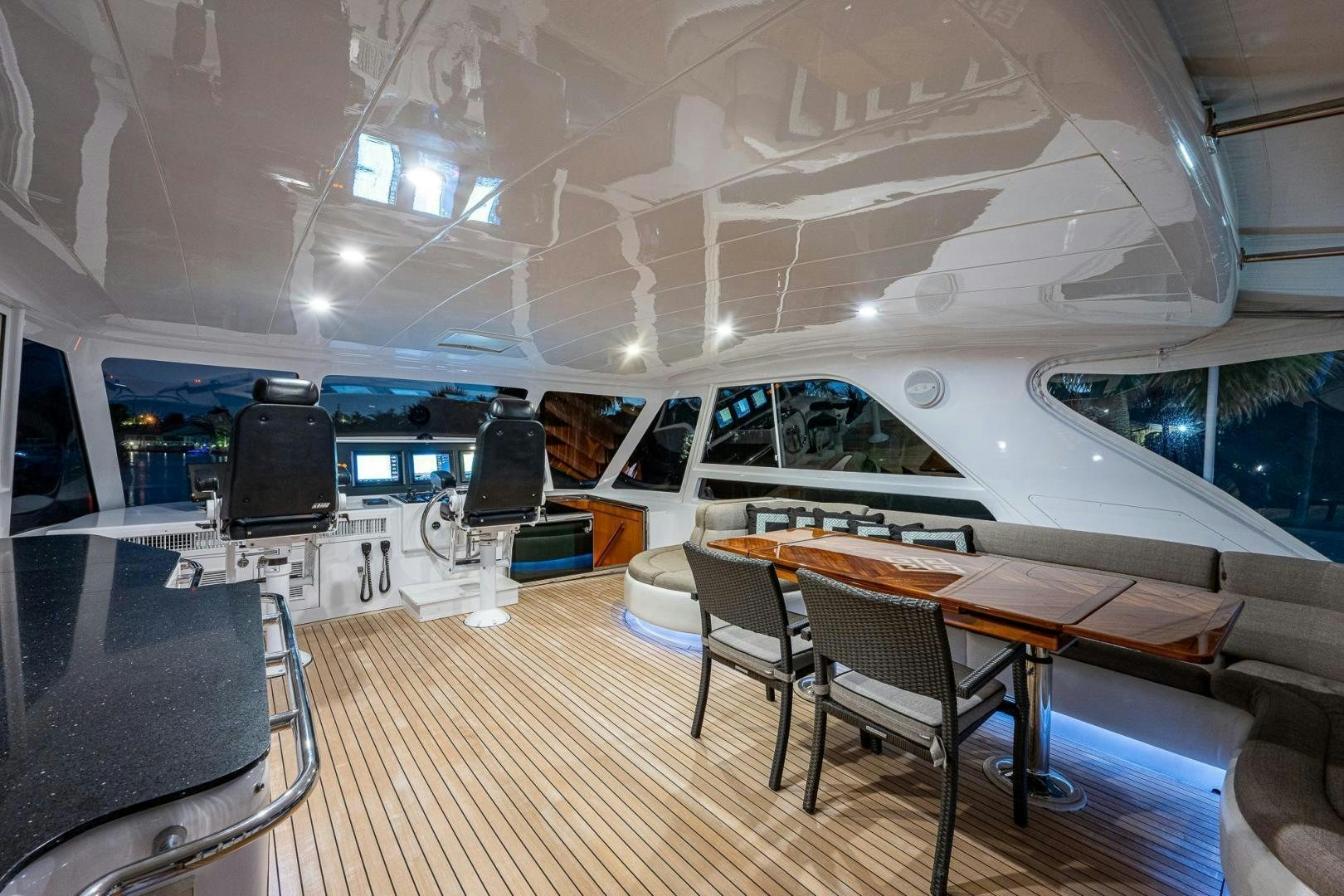 a room with a table and chairs aboard ODYSSEY Yacht for Sale