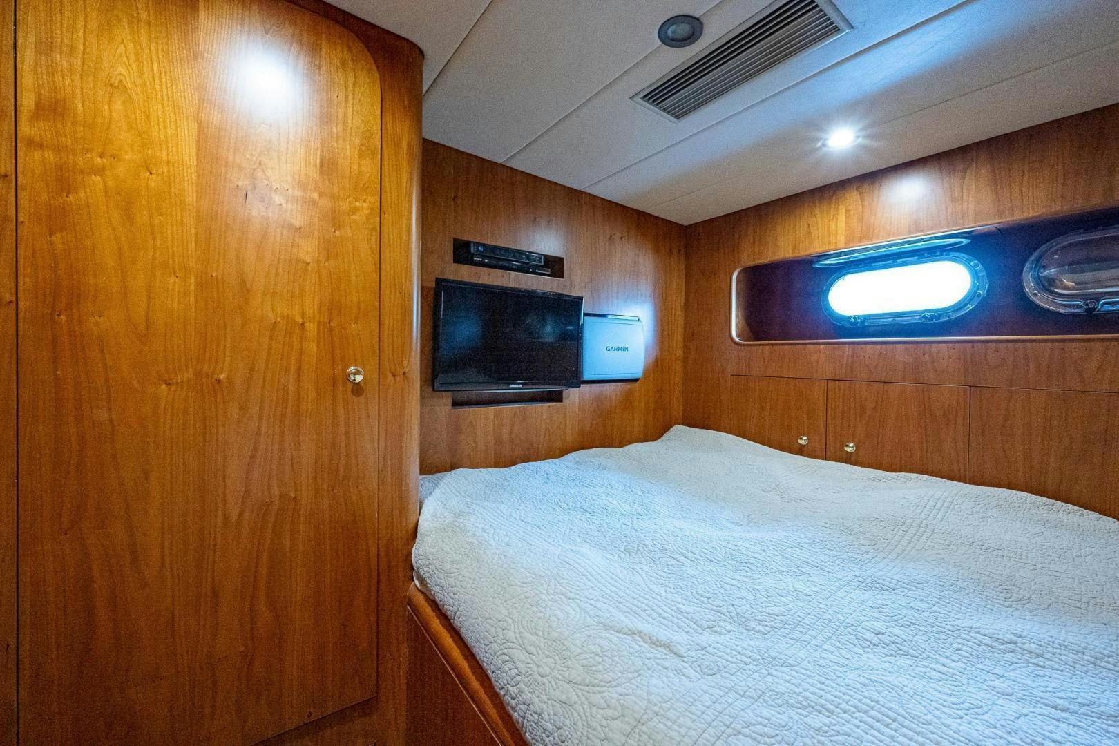 a bed in a room aboard ODYSSEY Yacht for Sale