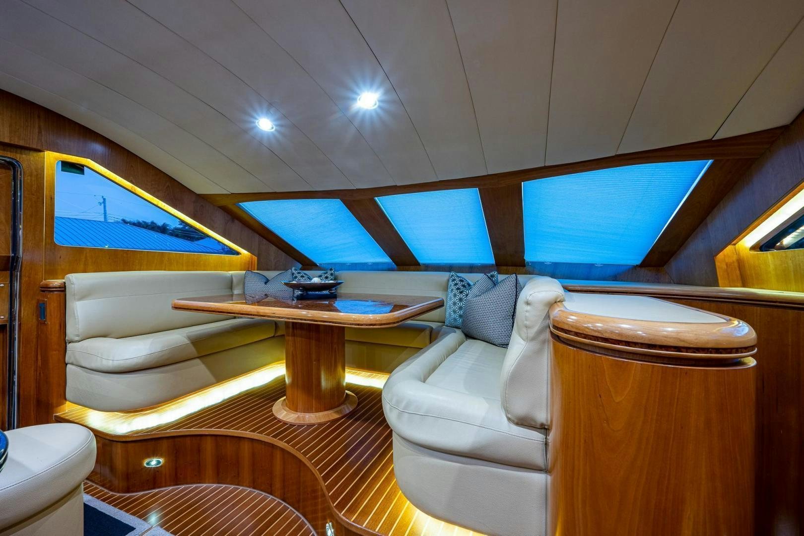 a room with a table and chairs aboard ODYSSEY Yacht for Sale