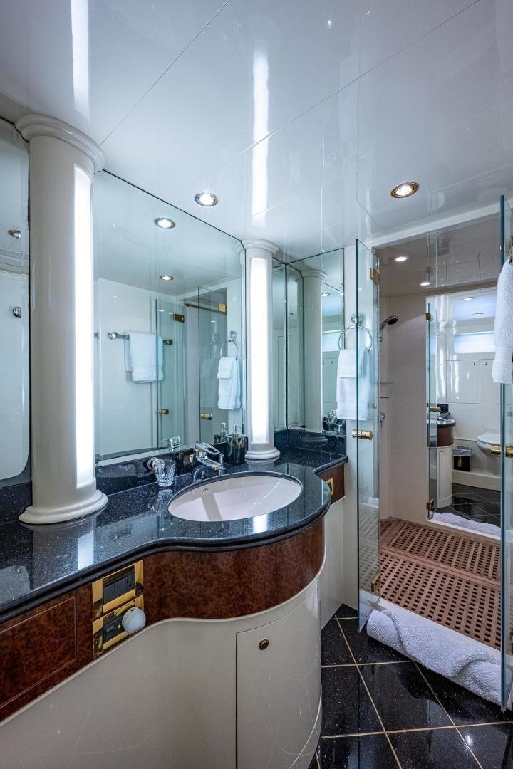 a bathroom with a large mirror aboard ODYSSEY Yacht for Sale