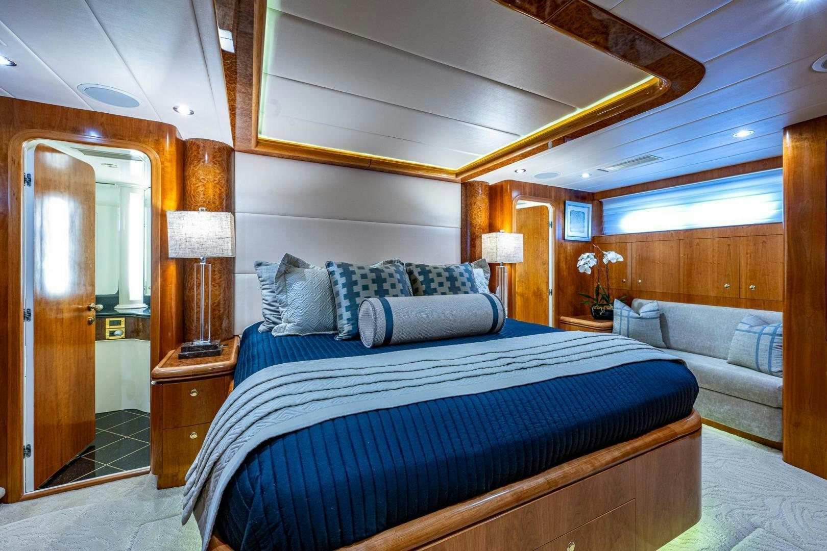 a bedroom with a bed and a door aboard ODYSSEY Yacht for Sale
