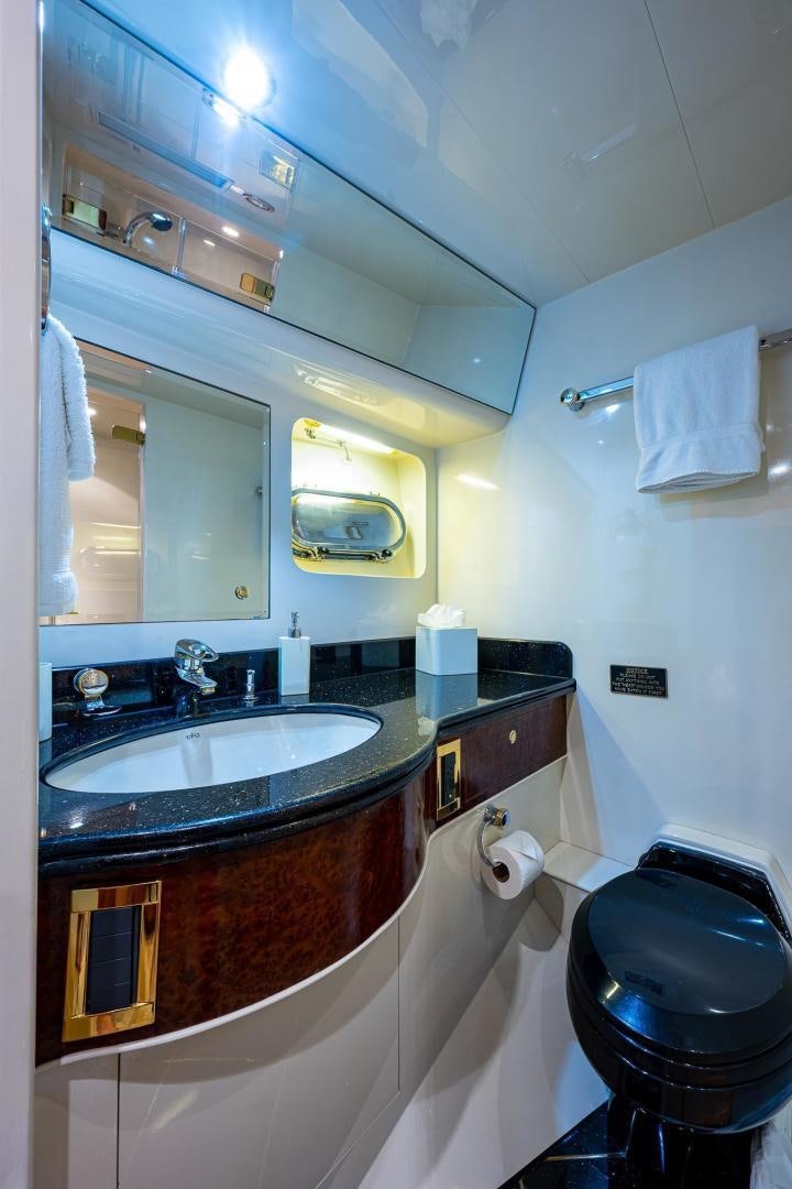 a bathroom with a sink and a mirror aboard ODYSSEY Yacht for Sale