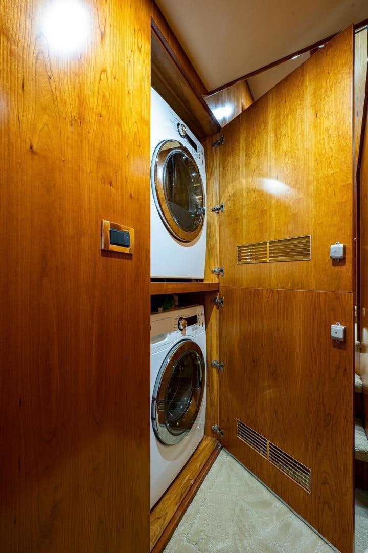 a washer and dryer in a room aboard ODYSSEY Yacht for Sale