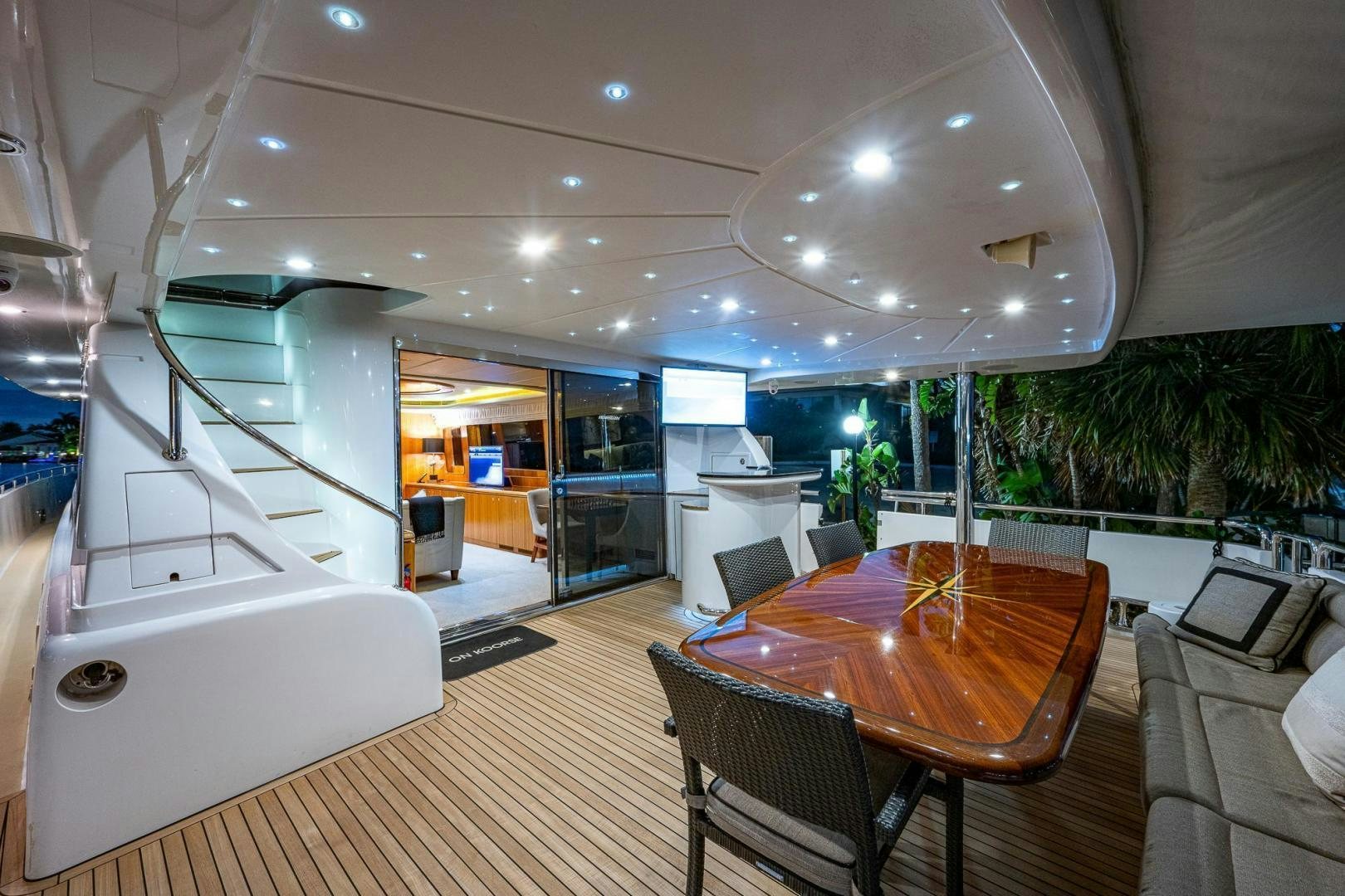 a large room with a table and chairs and a large jacuzzi aboard ODYSSEY Yacht for Sale