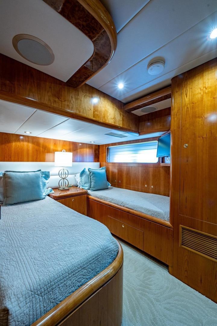 a room with two beds aboard ODYSSEY Yacht for Sale