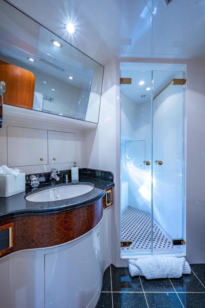 a bathroom with a shower and sink aboard ODYSSEY Yacht for Sale
