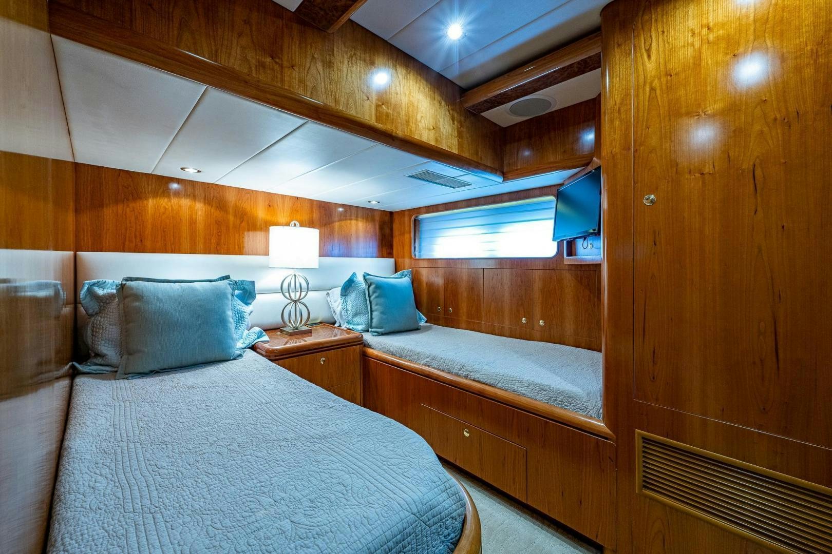 a room with two beds aboard ODYSSEY Yacht for Sale