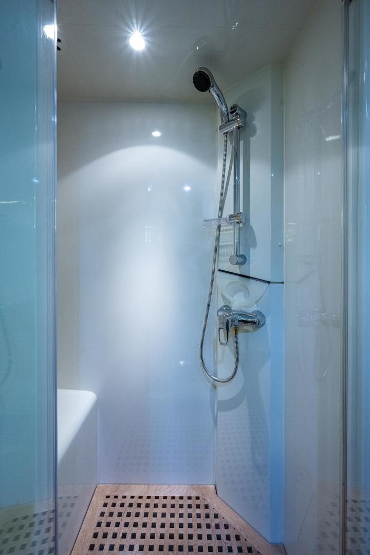a shower with a glass door aboard ODYSSEY Yacht for Sale