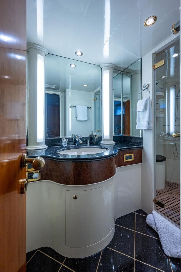 a bathroom with a large mirror aboard ODYSSEY Yacht for Sale