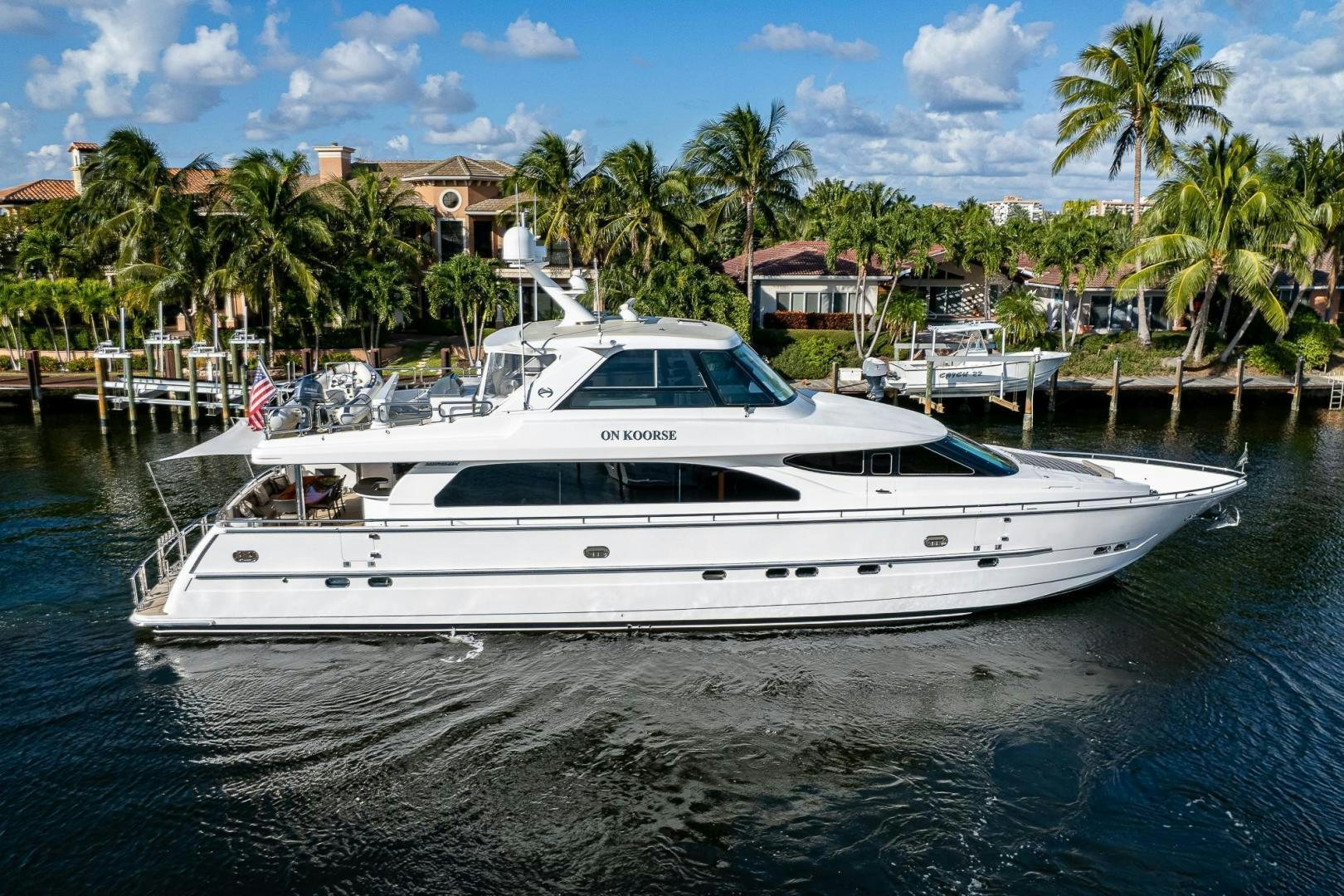 a white yacht in the water aboard ODYSSEY Yacht for Sale