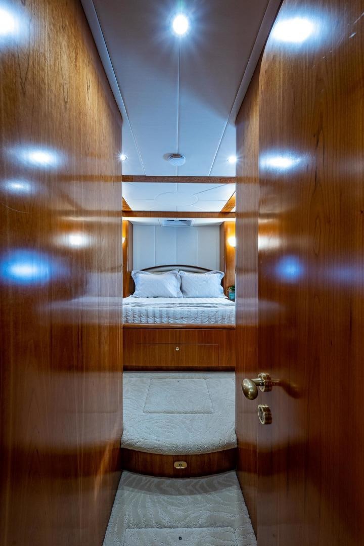 a wood door leading to a bedroom aboard ODYSSEY Yacht for Sale