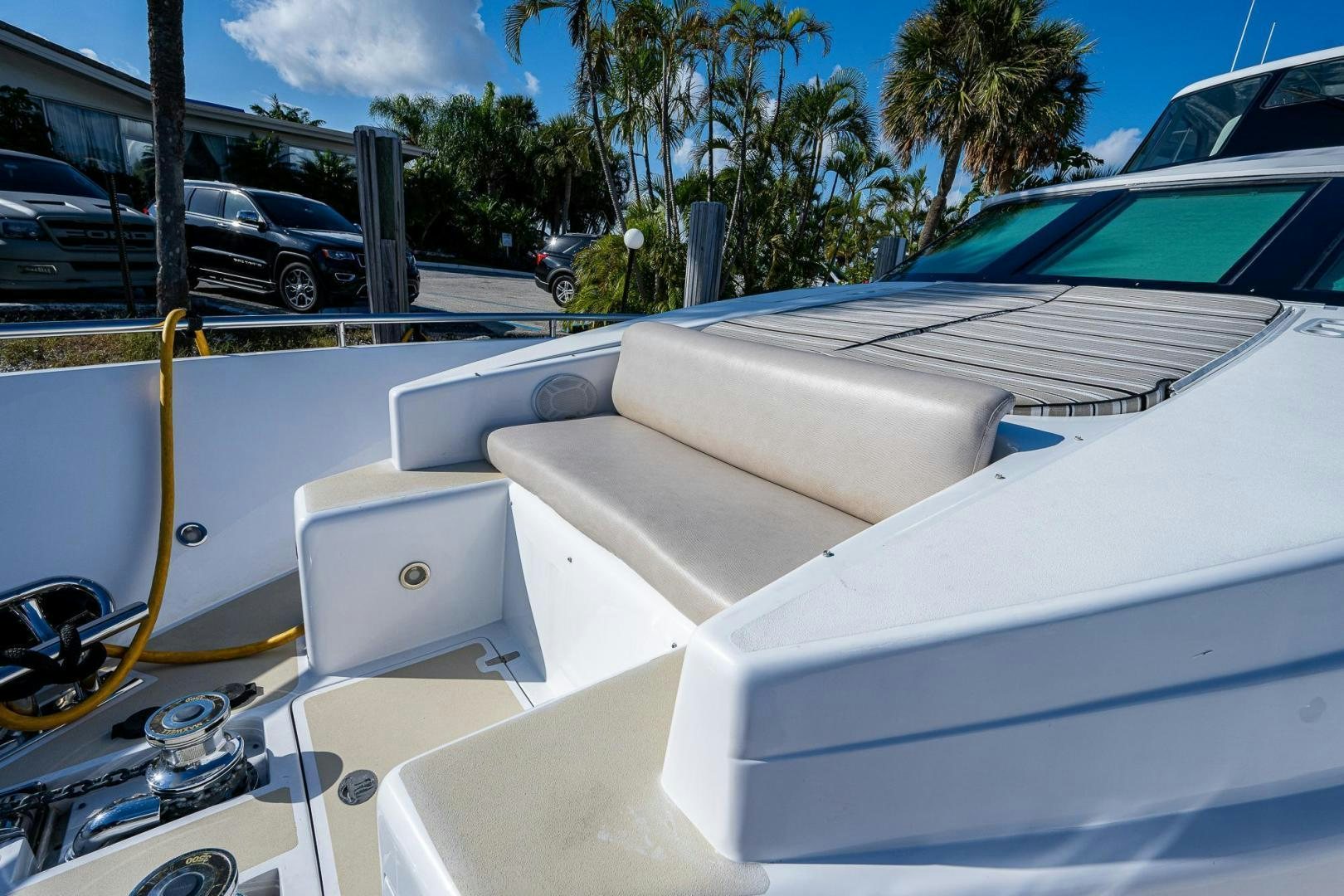 a white car with a large spoiler aboard ODYSSEY Yacht for Sale