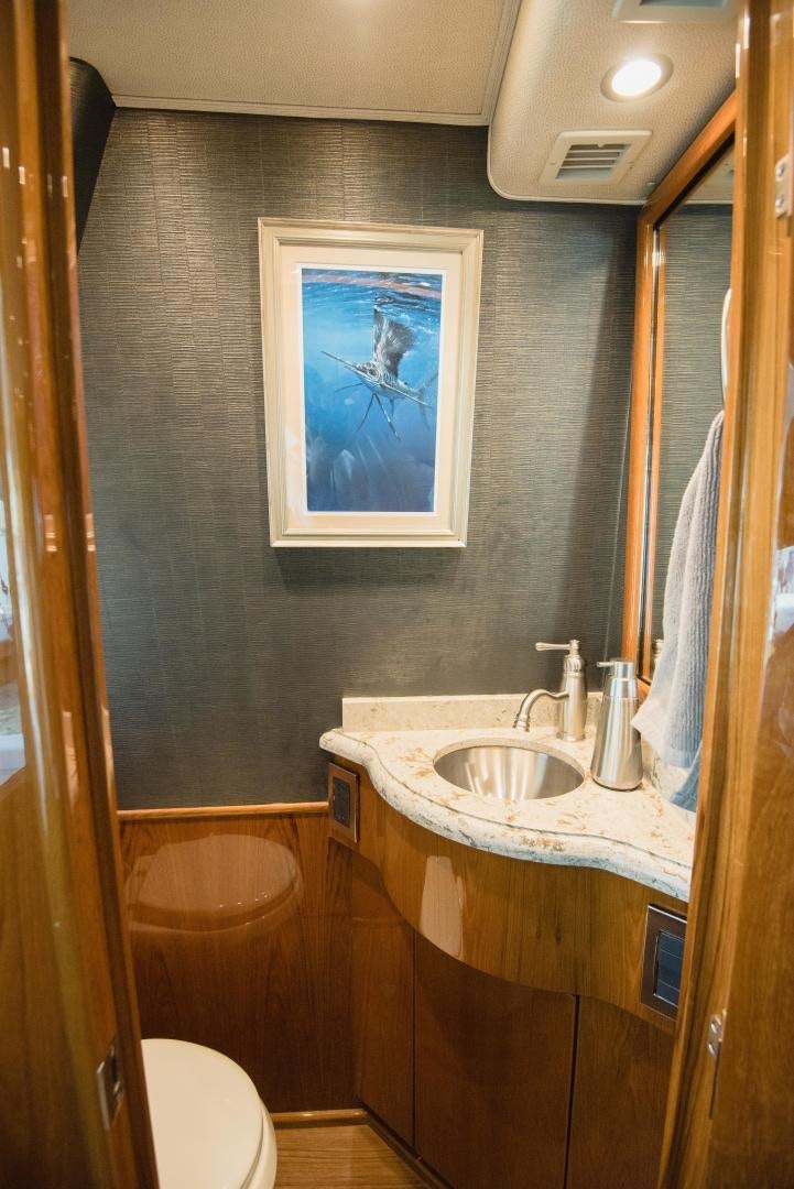 a bathroom with a painting on the wall aboard C STUDENT Yacht for Sale