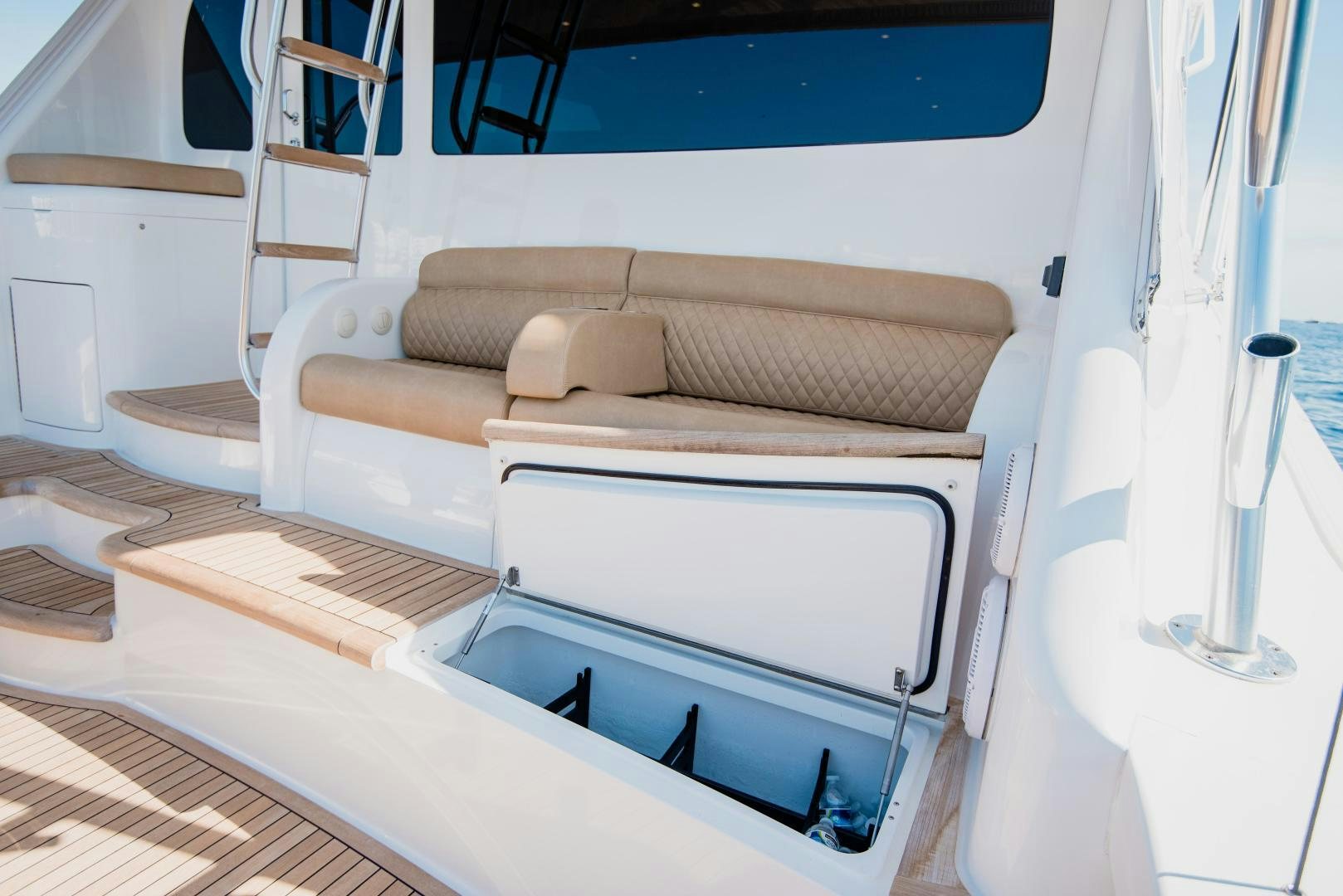 a white boat with a white bed frame and a white chair aboard C STUDENT Yacht for Sale