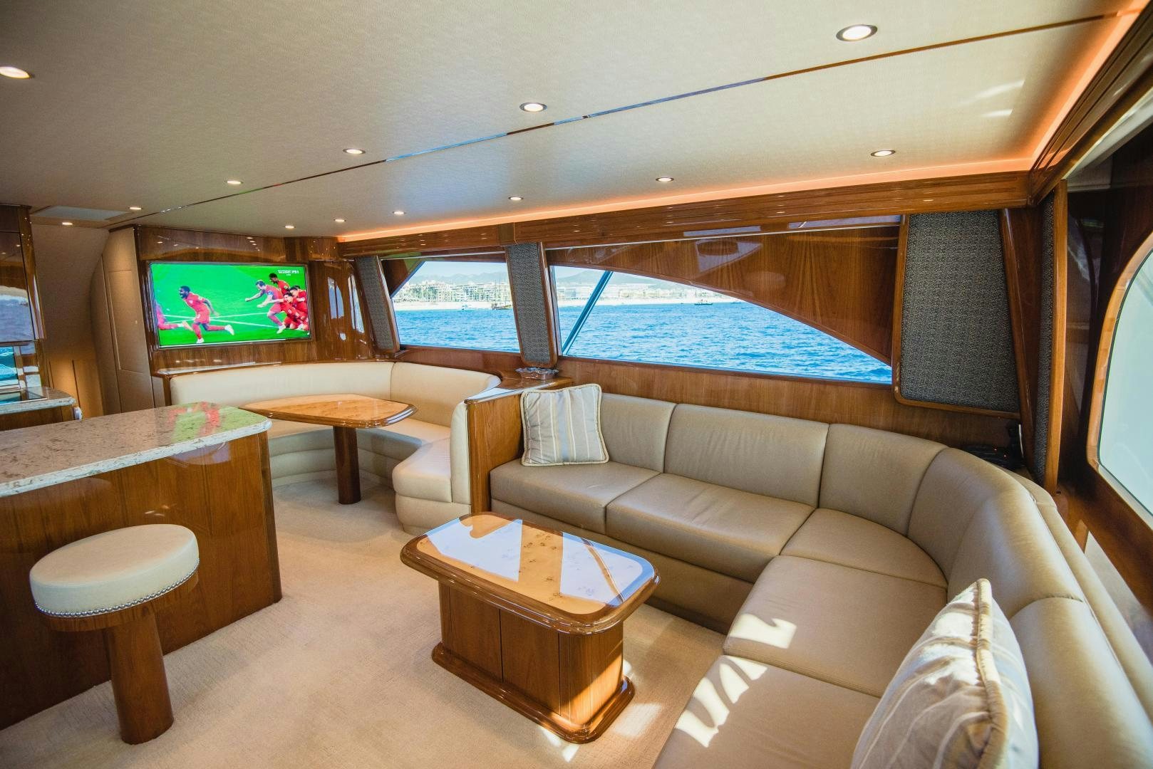 a living room with a large screen aboard C STUDENT Yacht for Sale