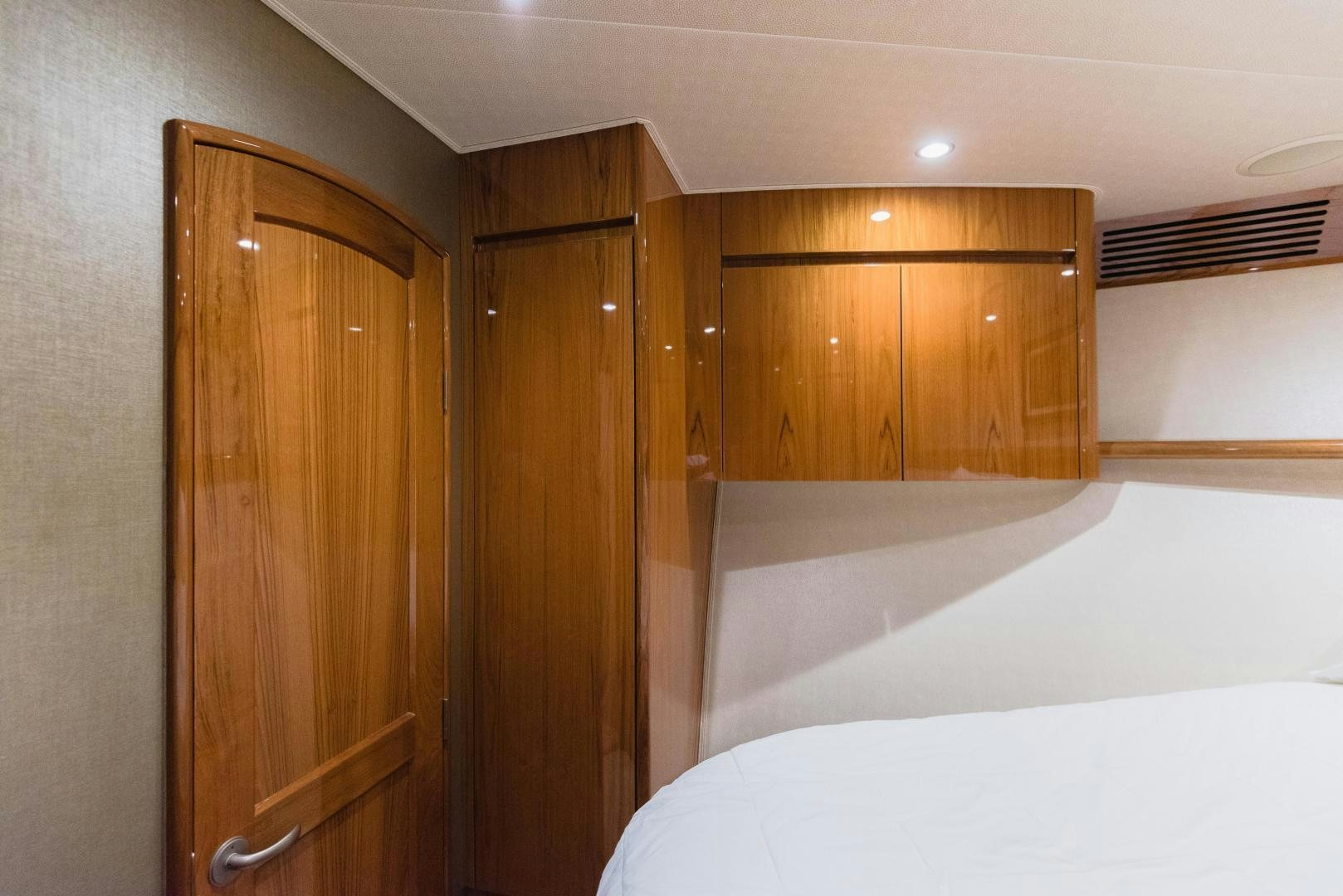 a room with a bed and a closet aboard C STUDENT Yacht for Sale