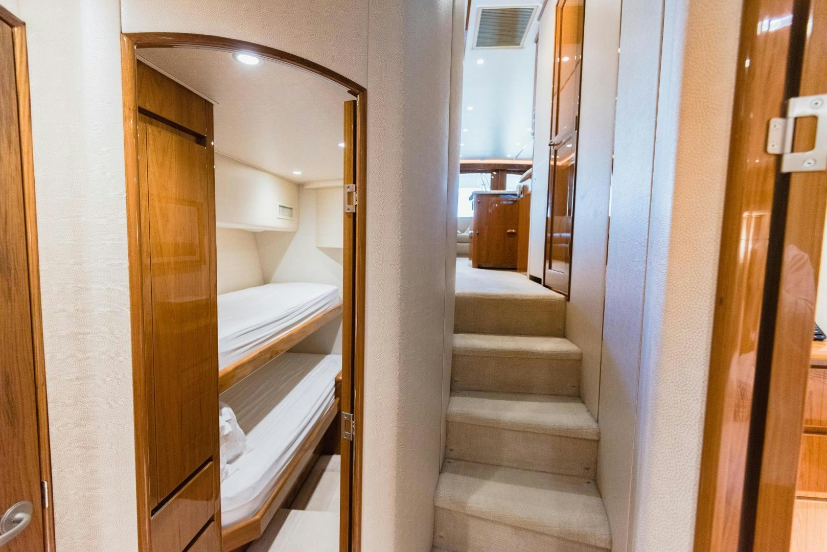 a hallway with a bed and a door aboard C STUDENT Yacht for Sale