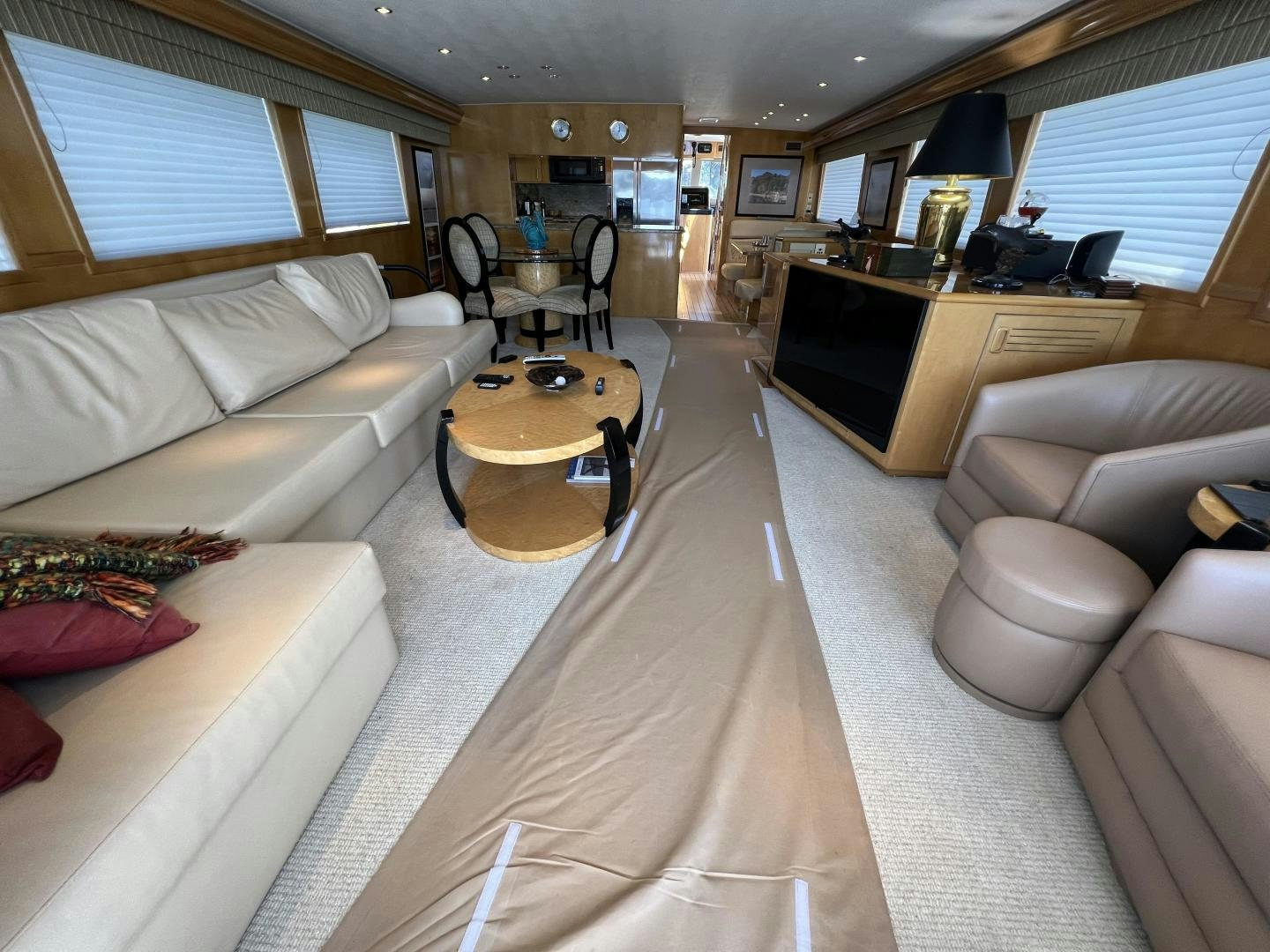 a living room with a couch and a table aboard LUCKY JOE Yacht for Sale