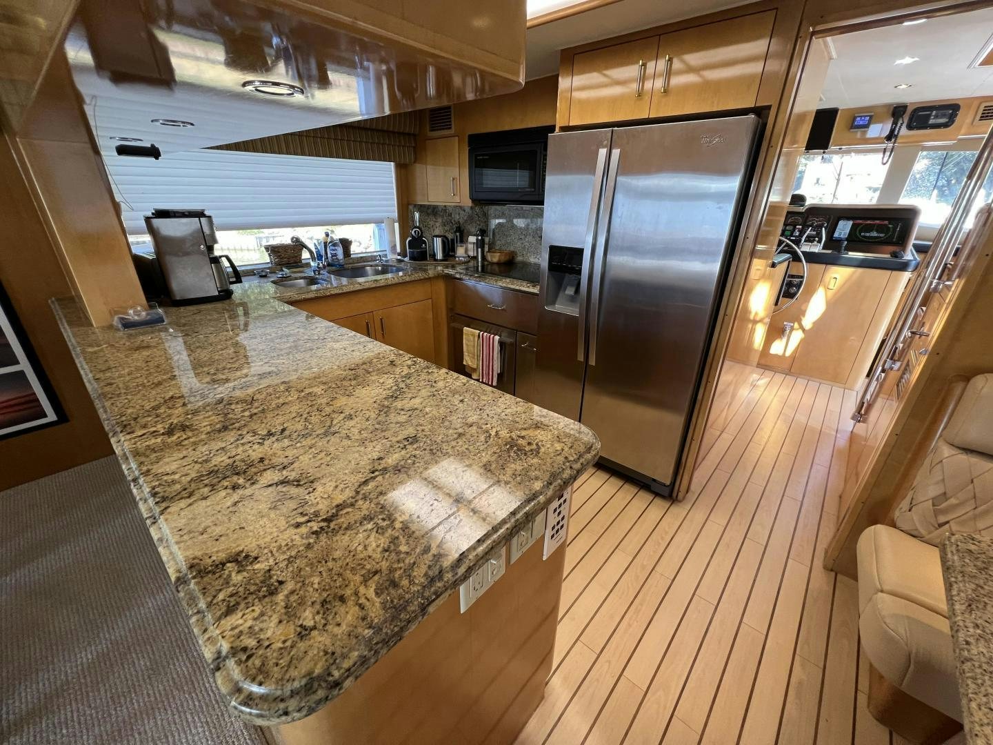 a large kitchen with a large marble counter top aboard LUCKY JOE Yacht for Sale