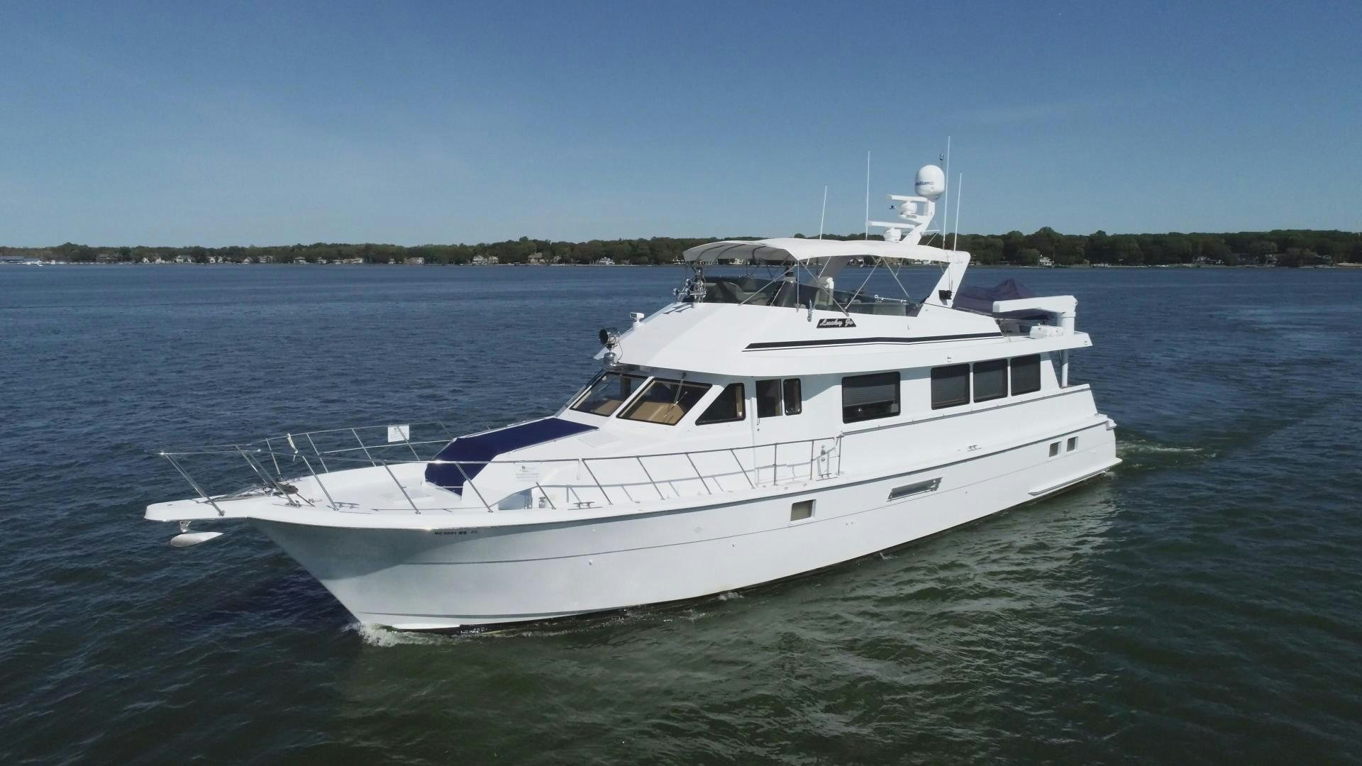 a white yacht on the water aboard LUCKY JOE Yacht for Sale