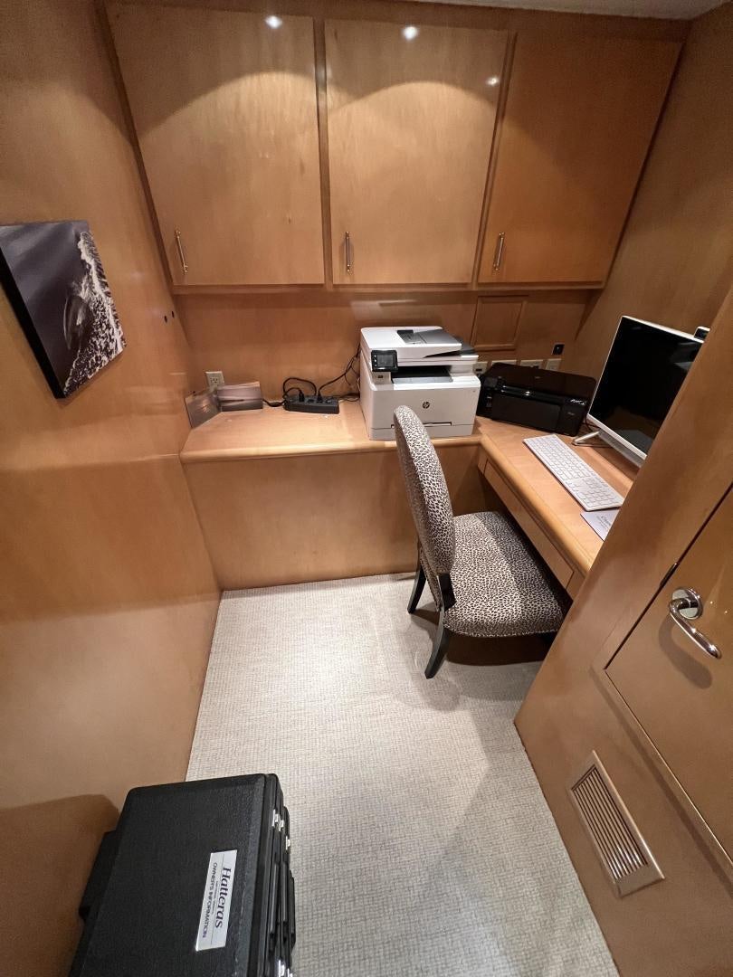 a room with a desk and computer aboard LUCKY JOE Yacht for Sale